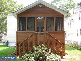 27 Harvard Road Audubon, NJ 08106 - Photo 11 of 12 a front view of a house with garden