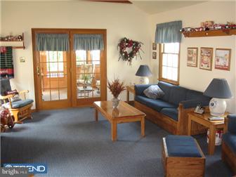 27 Harvard Road Audubon, NJ 08106 - Photo 6 of 12 a living room with furniture and a large window