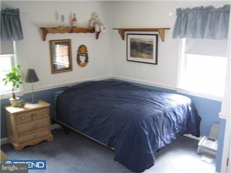 27 Harvard Road Audubon, NJ 08106 - Photo 9 of 12 a bedroom with a bed and a window