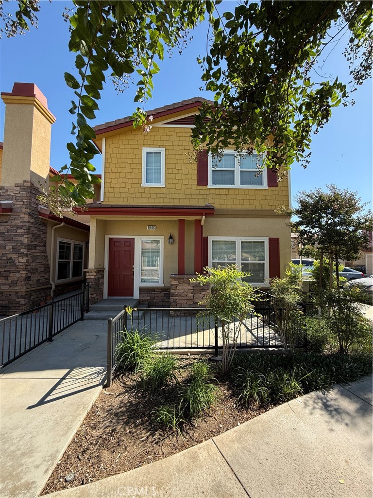 1510 Orange Avenue, Unit 1006 Redlands, CA 92373 - Photo 1 of 20 a front view of a house with garden