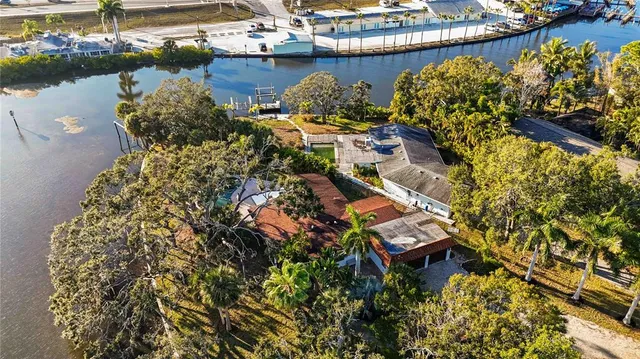 a aerial view of a house with a lake view