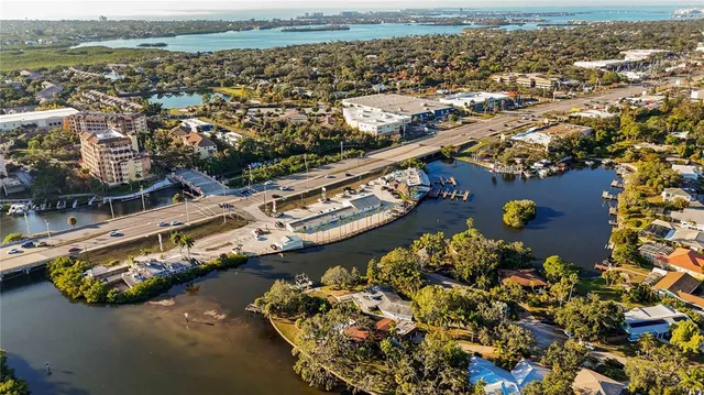 an aerial view of a house with a lake view