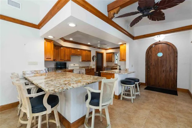 a kitchen with a table and chairs in it