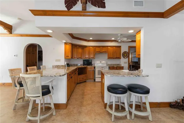 a kitchen with a table and chairs in it