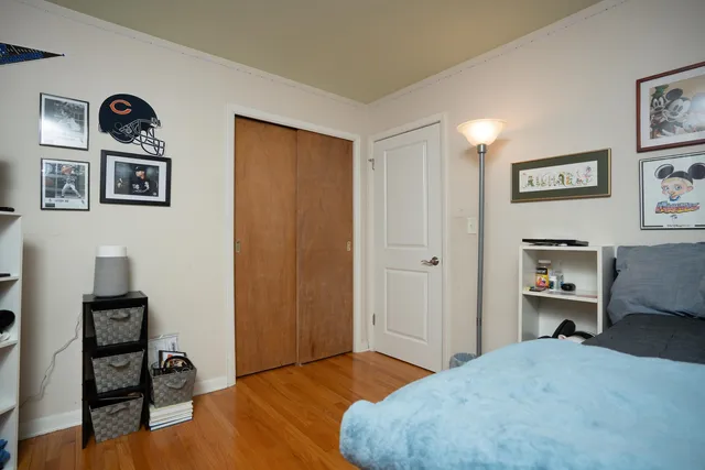 a bedroom with a bed and a workspace