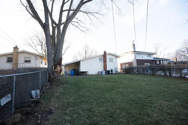 a house view with a backyard space
