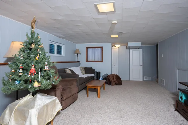 a living room with furniture flowers and flowers