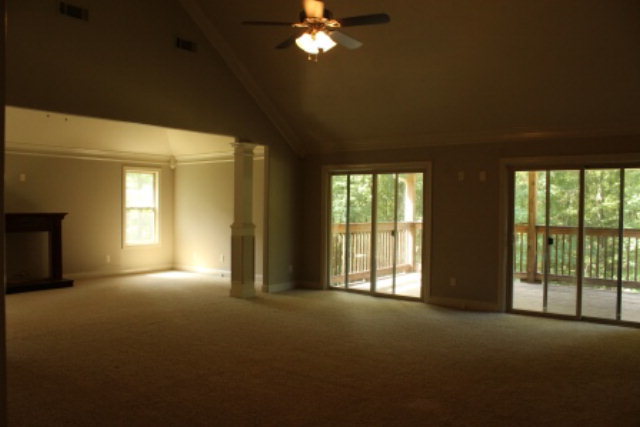 163 Gregory Road Forsyth, GA 31029 - Photo 12 of 20 a view of empty room with window and fireplace
