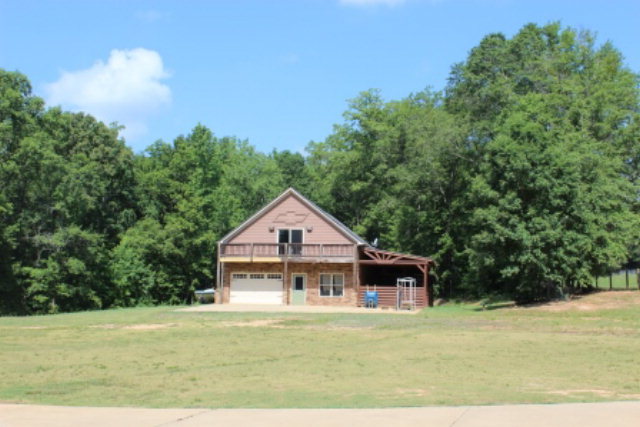 163 Gregory Road Forsyth, GA 31029 - Photo 20 of 20 a view of a house with a big yard and large trees