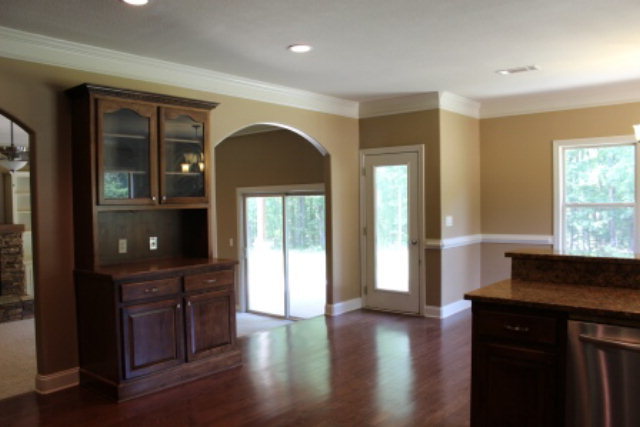 163 Gregory Road Forsyth, GA 31029 - Photo 9 of 20 a kitchen with a refrigerator and a sink