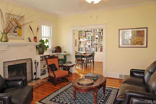 1707 Dare Street Raleigh, NC 27608 - Photo 5 of 12 Relax by the wood burning fireplace in the bright, open living room. Other