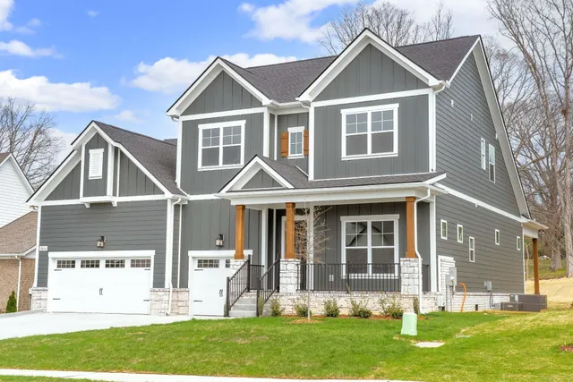 front view of a house with a yard