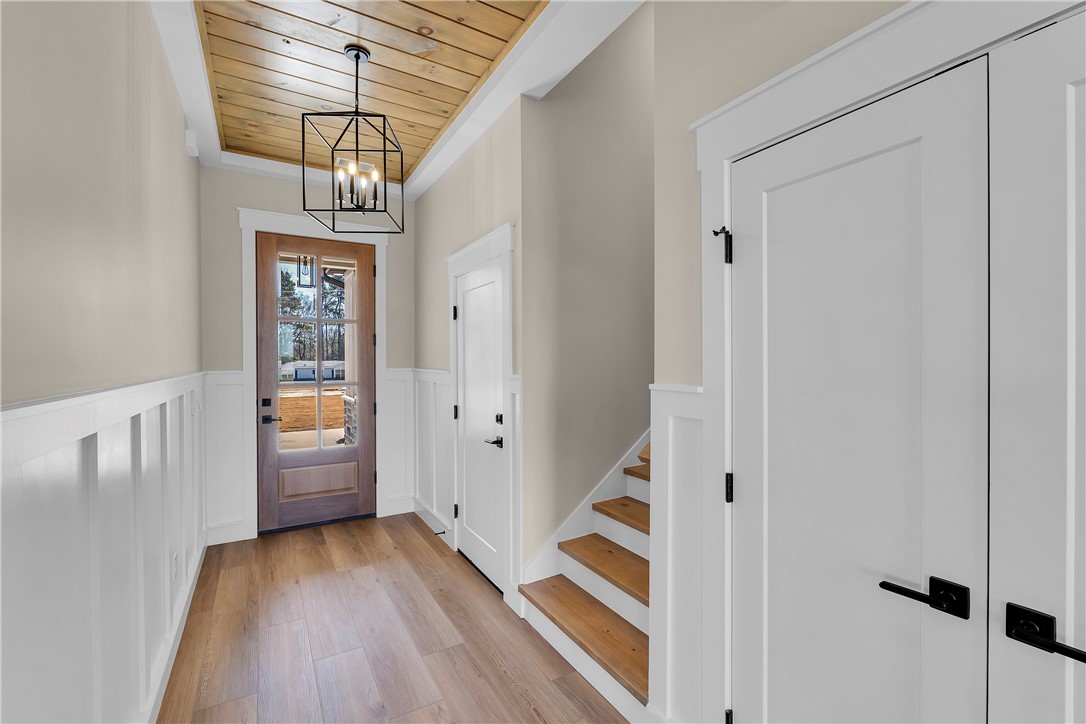2816 Smith McGee Road Iva, SC 29655 - Photo 24 of 25 A welcoming entryway with a natural wood ceiling and wide plank flooring offers an inviting transition to the home's interior.