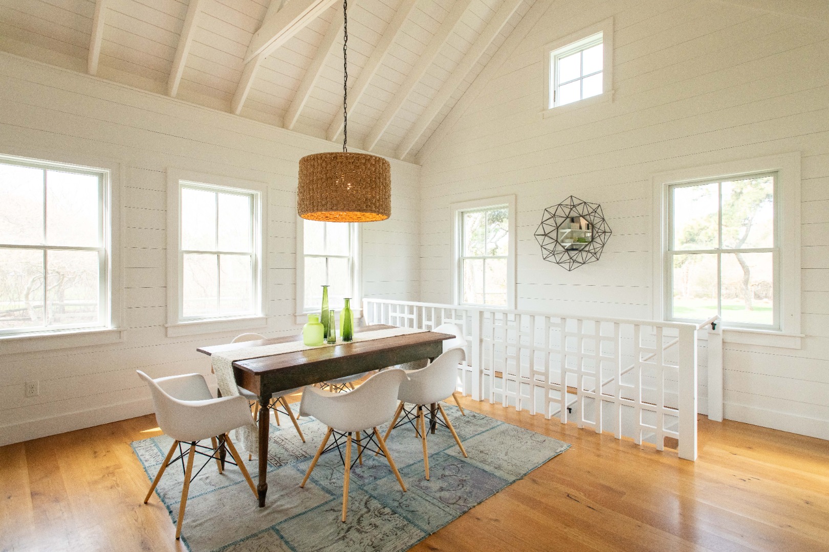 146 Surfside Road Nantucket, MA 02554 - Photo 4 of 43 a view of a dining room with furniture and wooden floor
