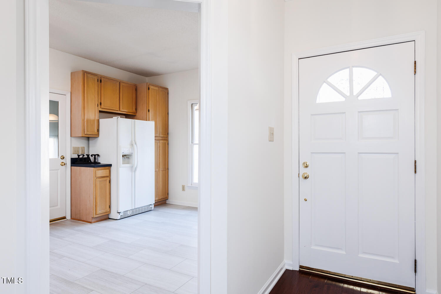 3717 Carnegie Lane Raleigh, NC 27612 - Photo 4 of 28 an empty room with a window and wooden floor