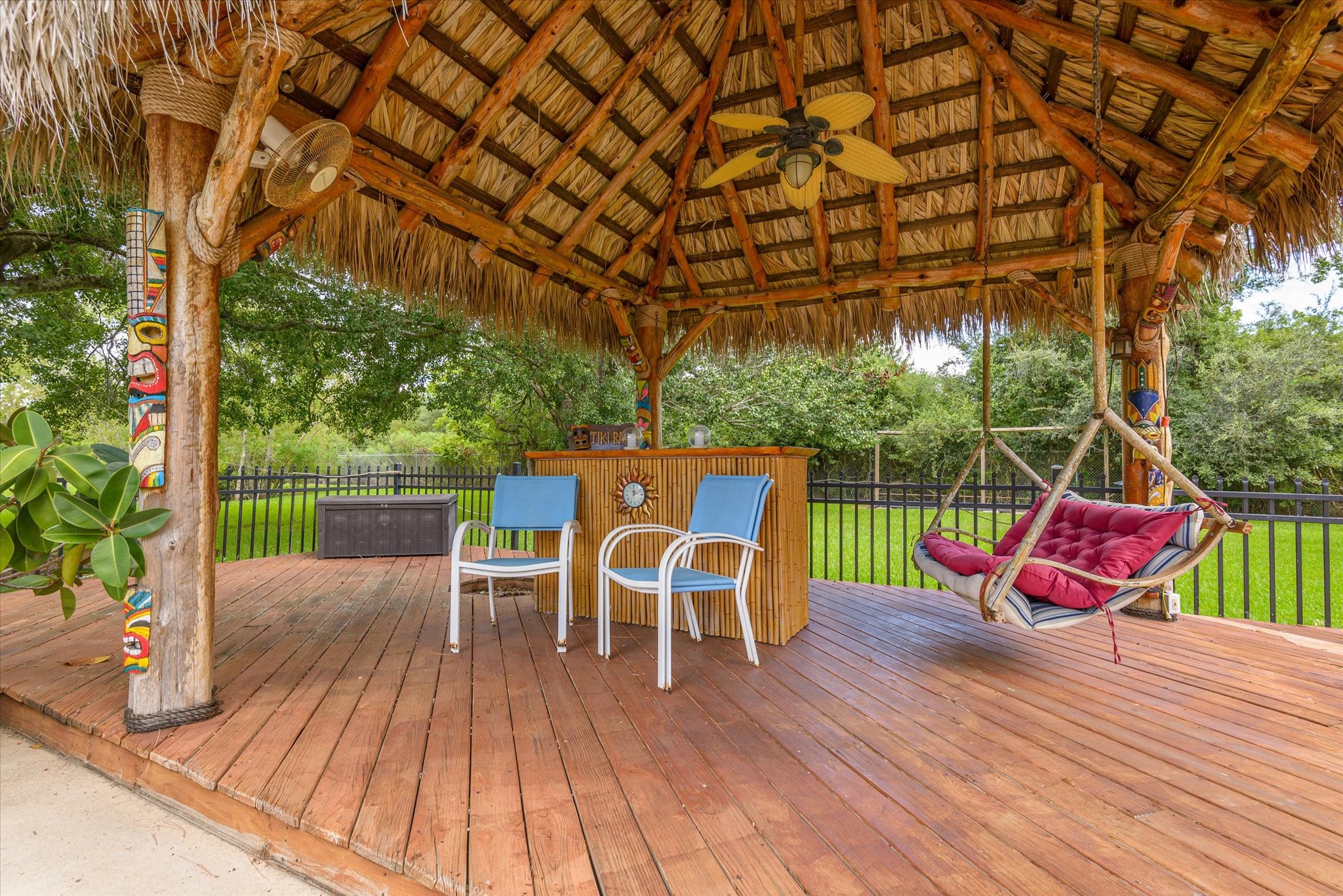 2739 Lawrence Road Kemah, TX 77565 - Photo 11 of 42 a view of a chairs and table in the patio with a yard