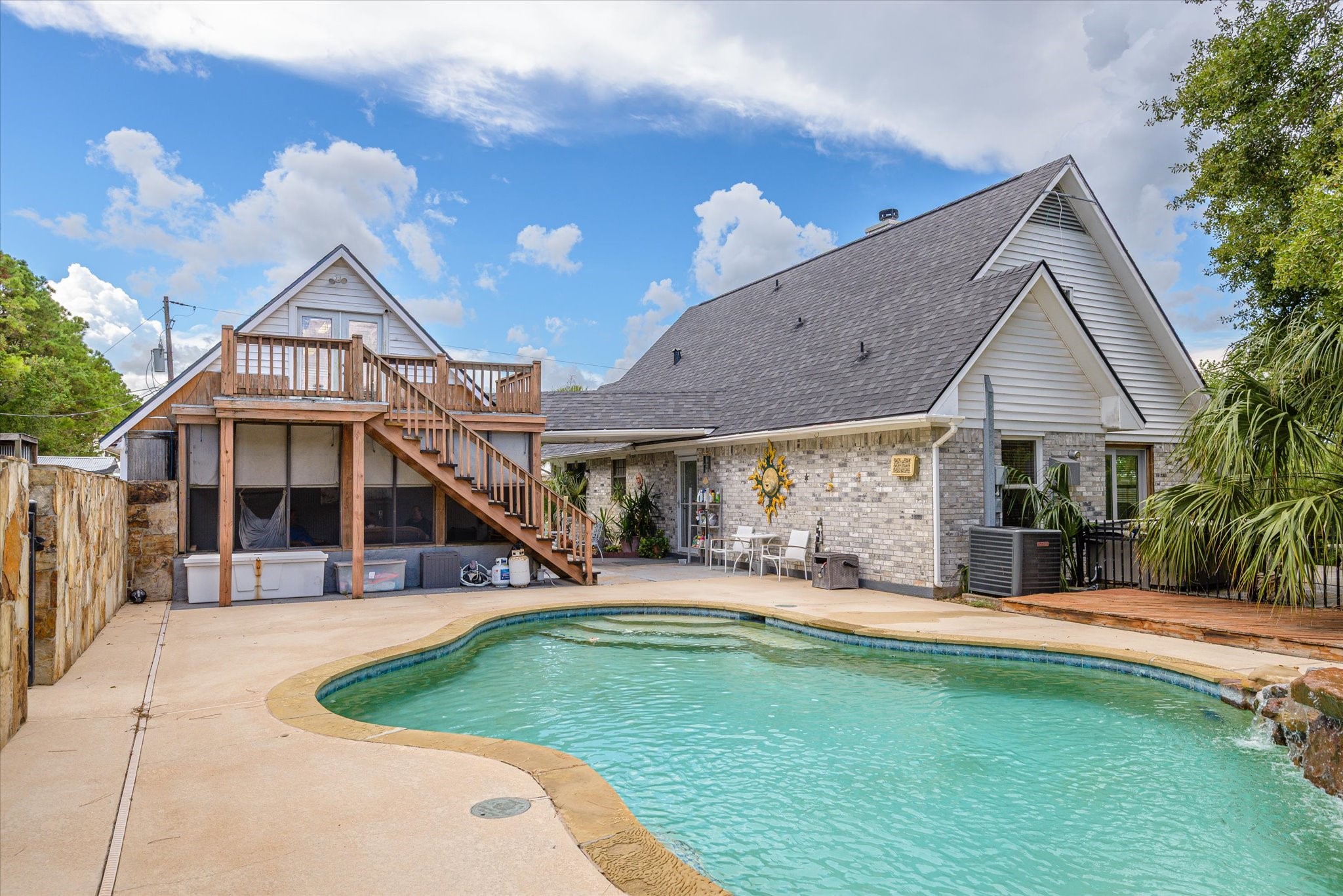 2739 Lawrence Road Kemah, TX 77565 - Photo 12 of 42 a front view of a house with a yard table and chairs