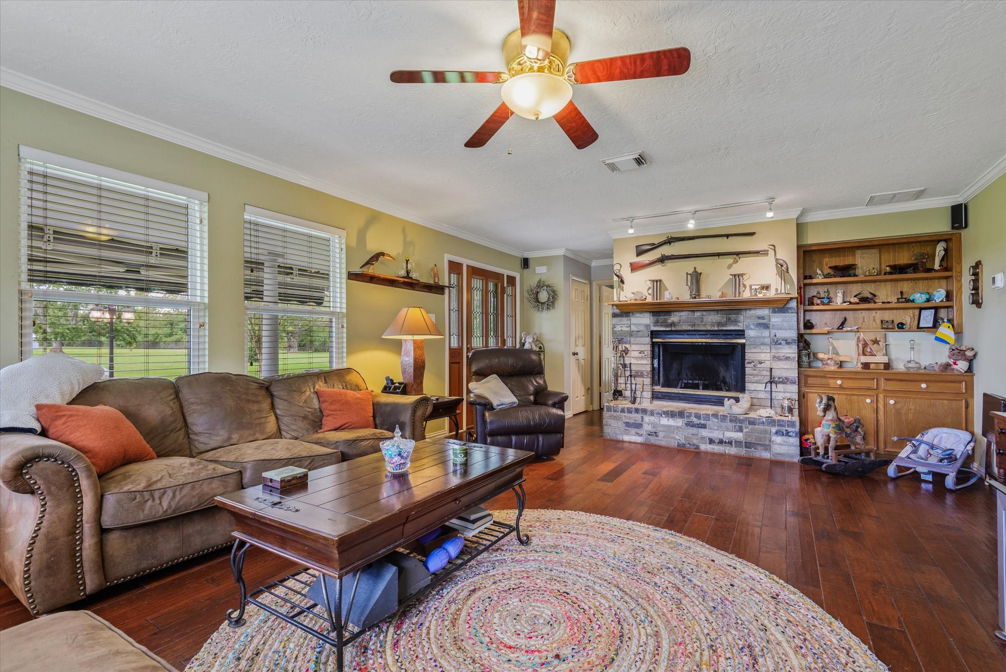 2739 Lawrence Road Kemah, TX 77565 - Photo 16 of 42 a living room with furniture fireplace and a large window