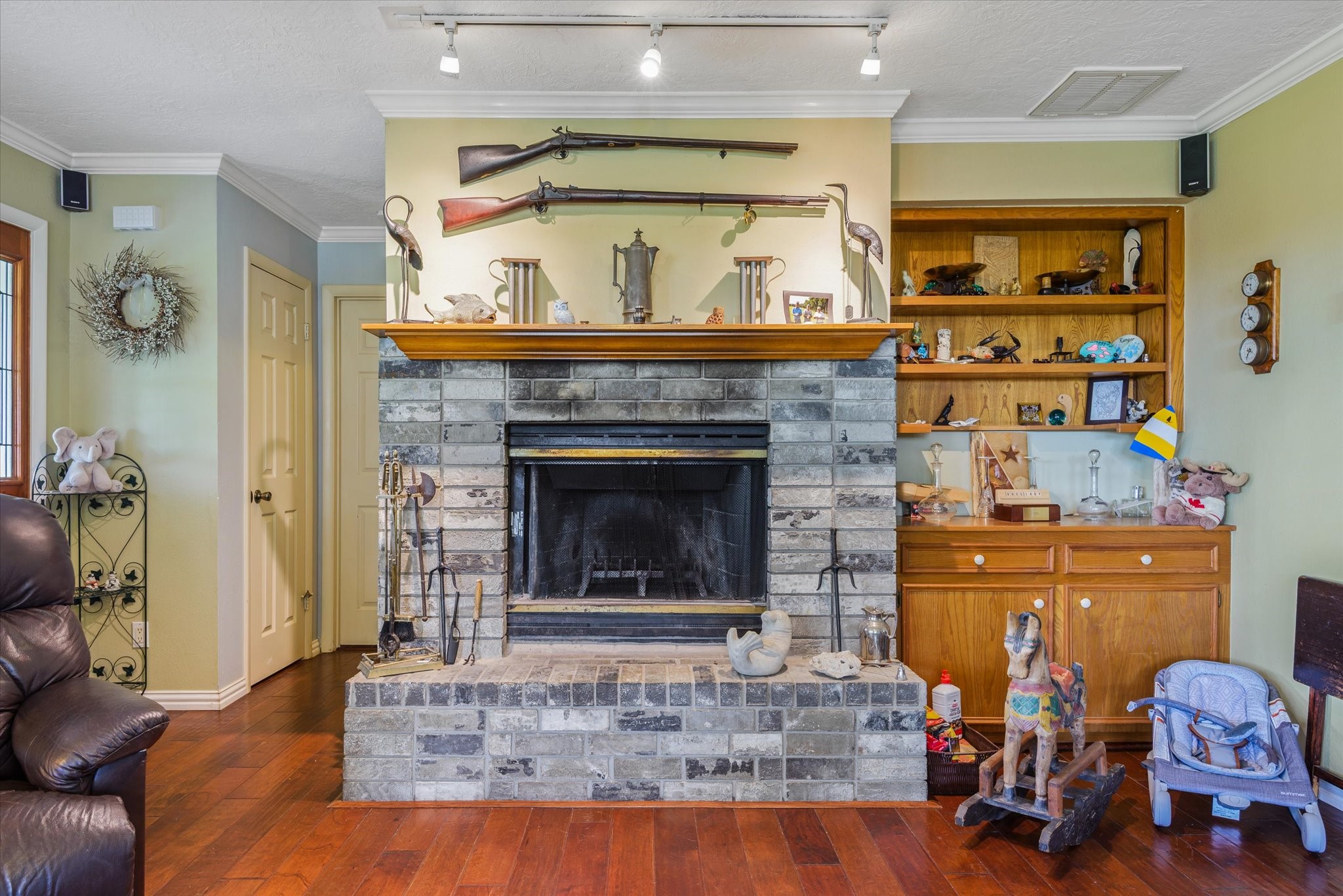 2739 Lawrence Road Kemah, TX 77565 - Photo 17 of 42 a living room with furniture and a fireplace