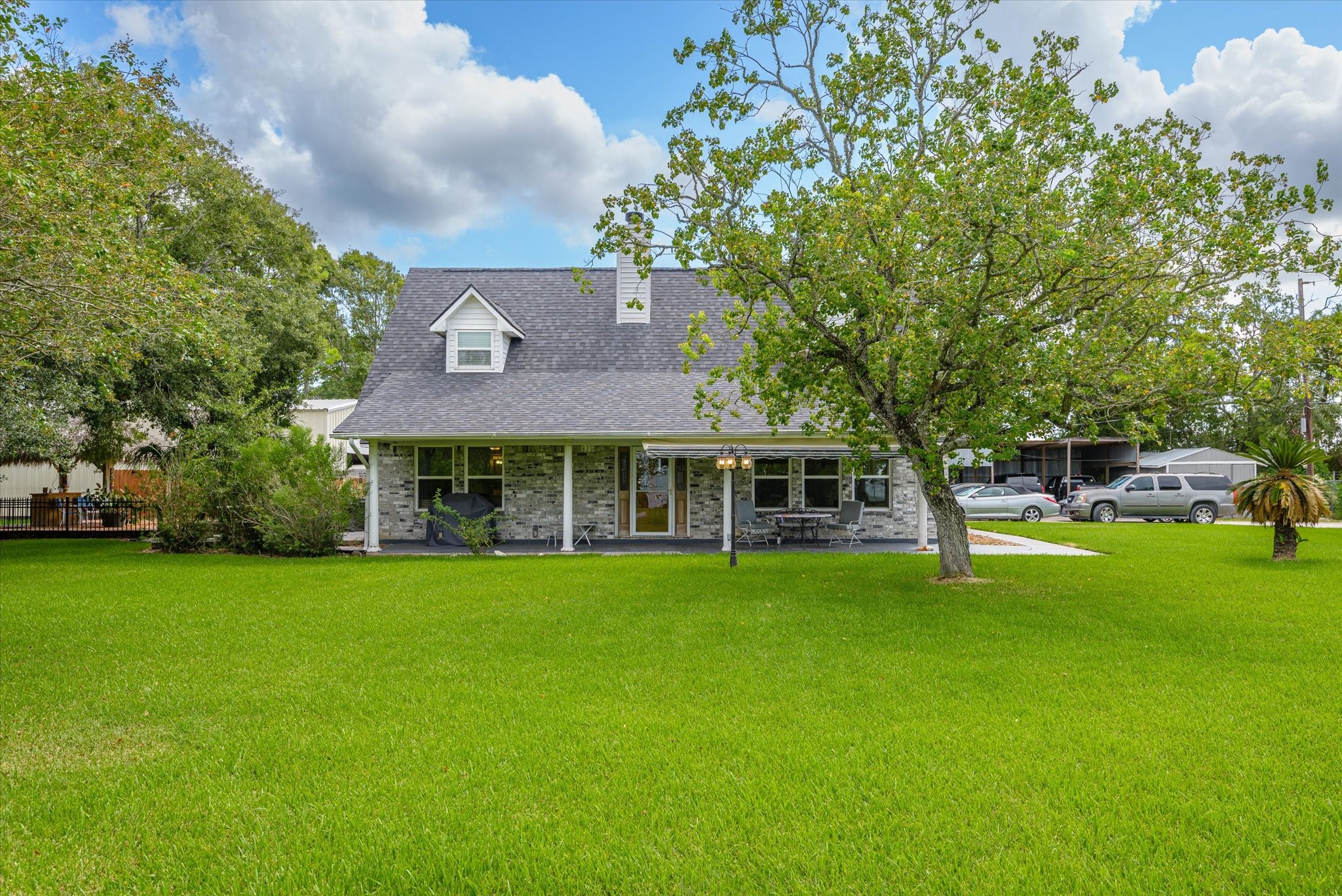 2739 Lawrence Road Kemah, TX 77565 - Photo 2 of 42 a front view of a house with a garden