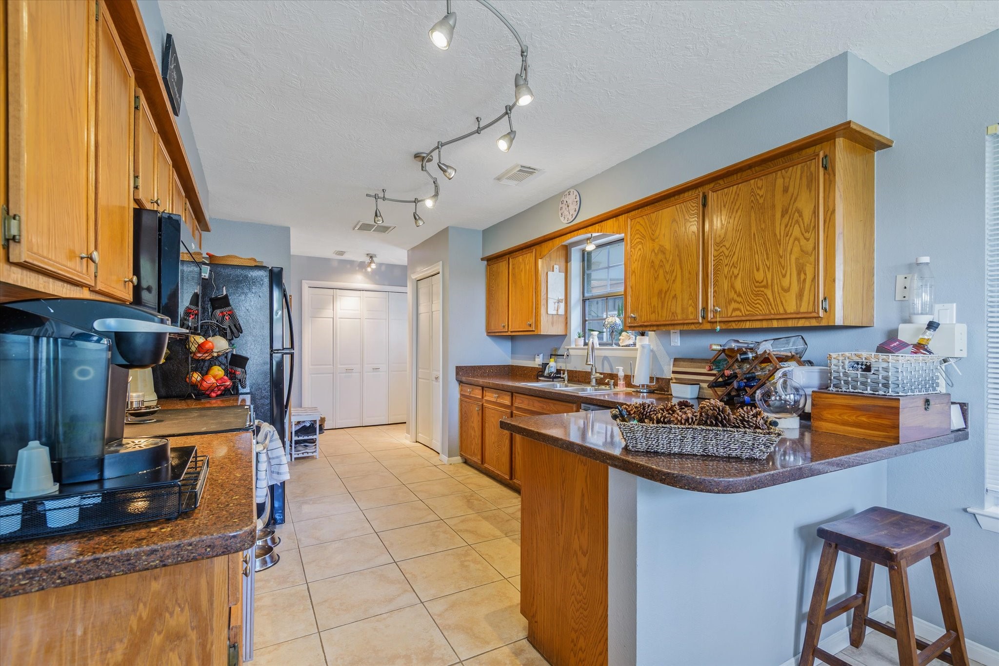 2739 Lawrence Road Kemah, TX 77565 - Photo 22 of 42 a kitchen with a sink appliances and cabinets