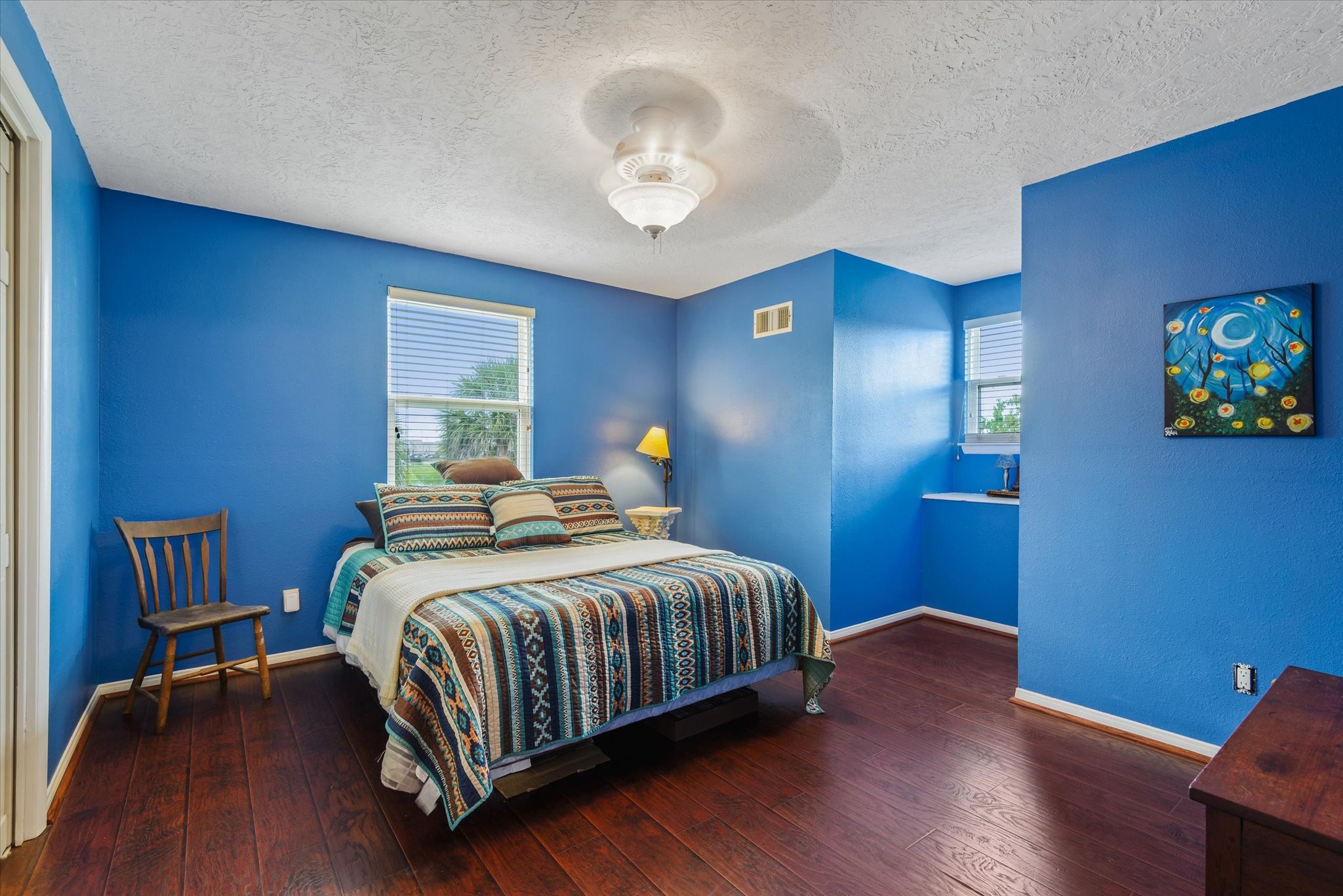 2739 Lawrence Road Kemah, TX 77565 - Photo 28 of 42 a bedroom with a bed and a chandelier