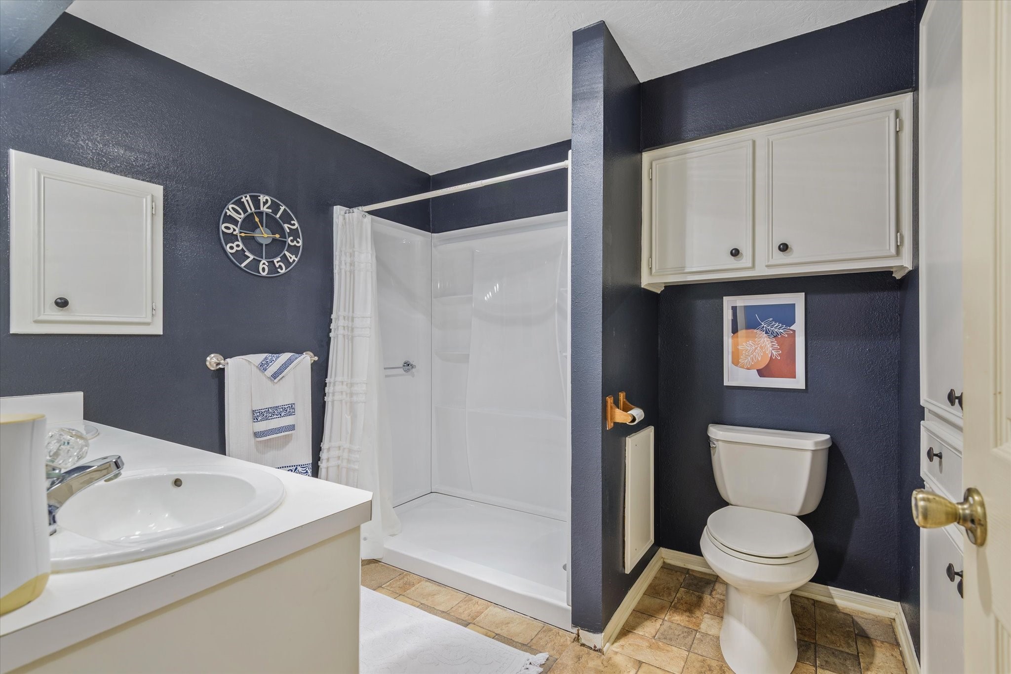 2739 Lawrence Road Kemah, TX 77565 - Photo 29 of 42 a white toilet sitting next to a bathroom sink