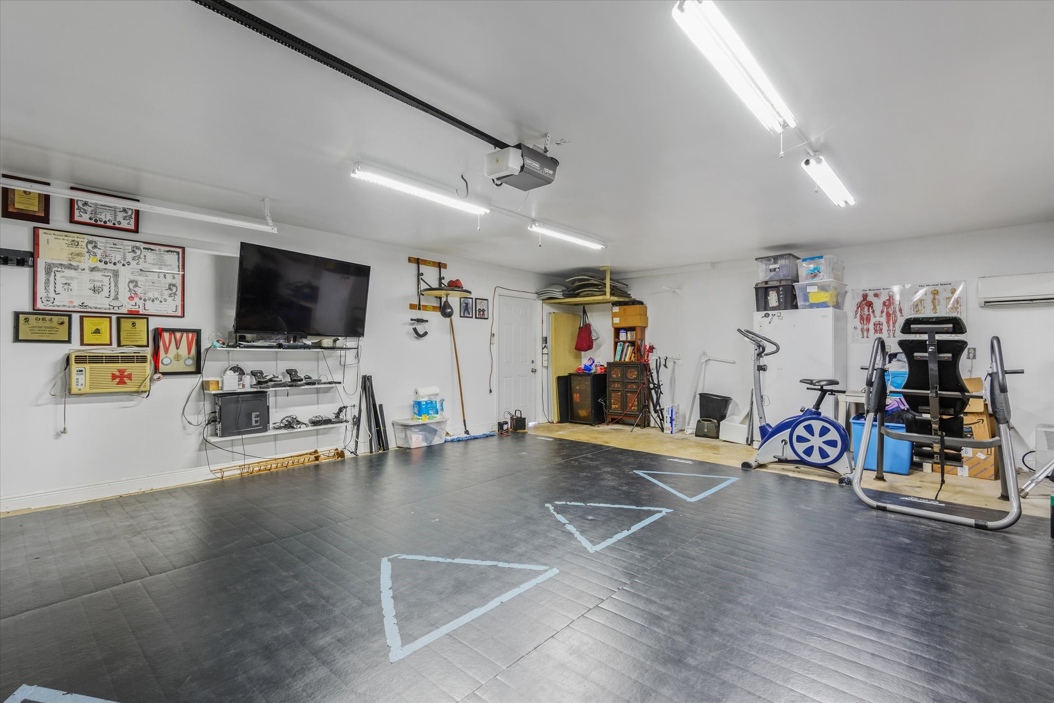 2739 Lawrence Road Kemah, TX 77565 - Photo 32 of 42 a view of a livingroom with wooden floor and a flat screen tv