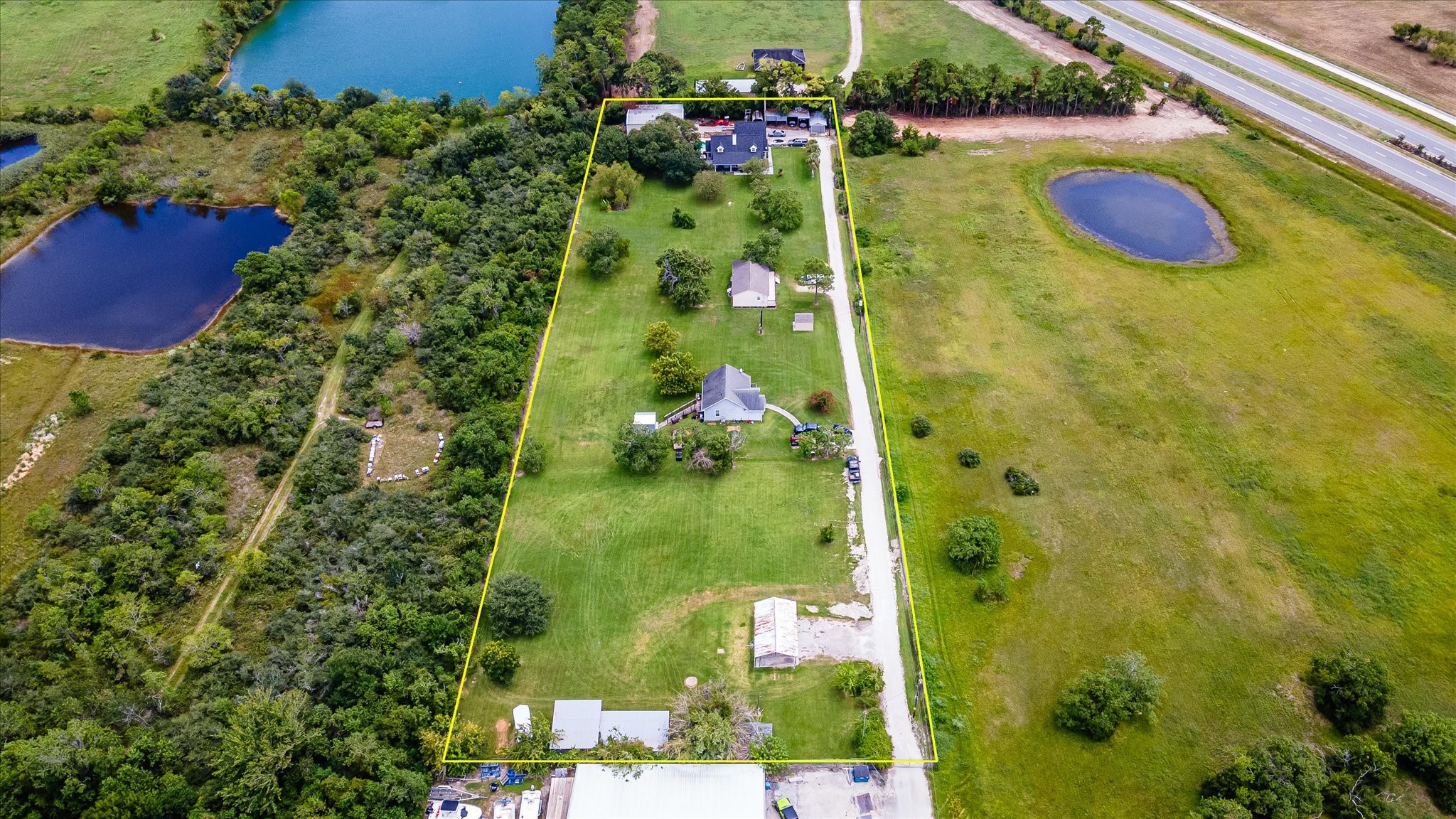 2739 Lawrence Road Kemah, TX 77565 - Photo 5 of 42 an aerial view of residential house with outdoor space and trees all around