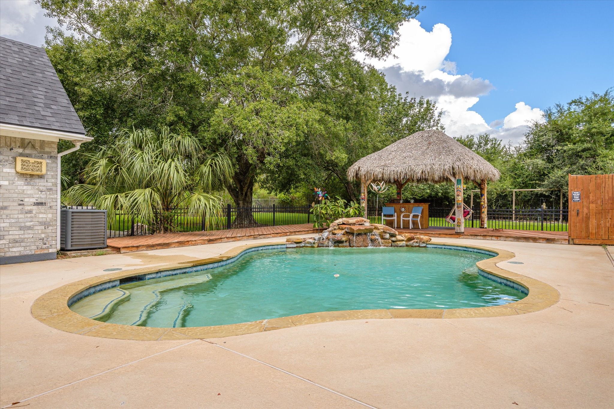 2739 Lawrence Road Kemah, TX 77565 - Photo 9 of 42 a view of a swimming pool with a patio