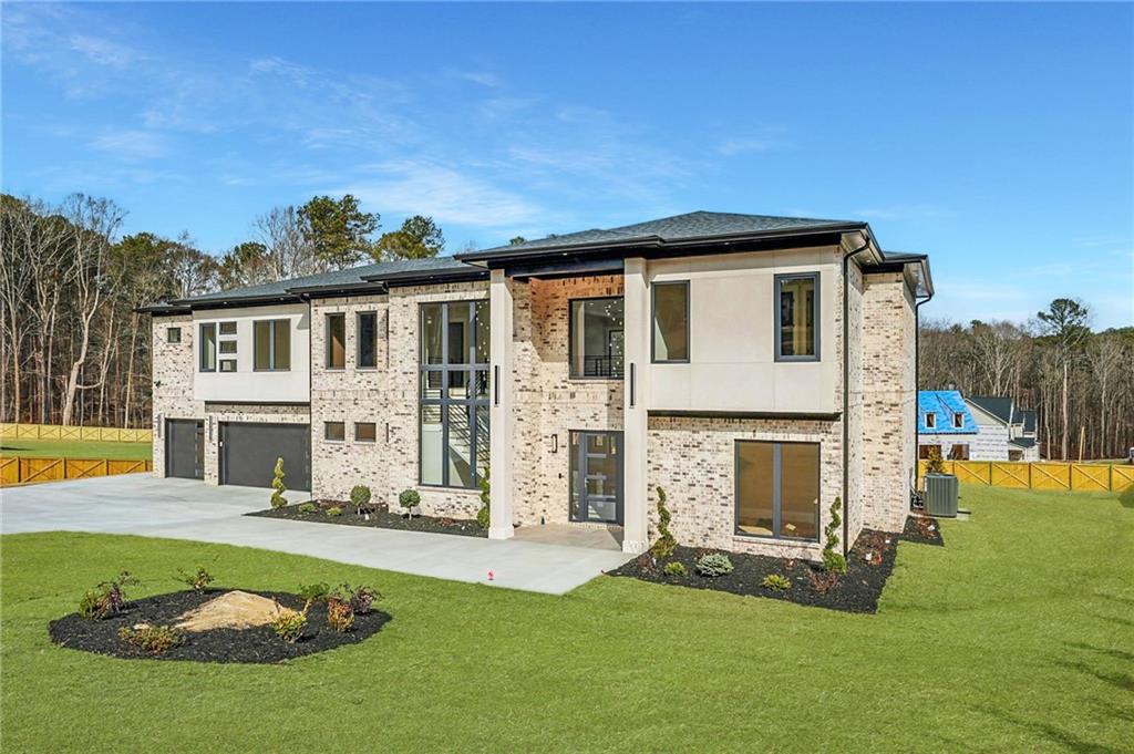 1556 Ewing Chapel Road Dacula, GA 30019 - Photo 2 of 67 a view of a house with a swimming pool