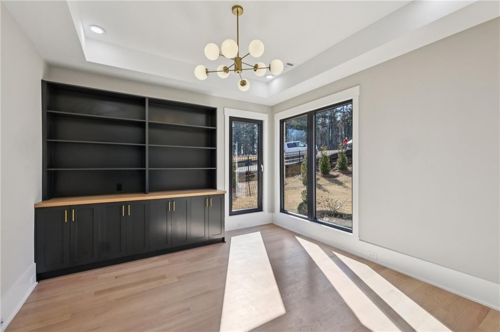 1556 Ewing Chapel Road Dacula, GA 30019 - Photo 22 of 67 a view of an empty room with a window and a kitchen