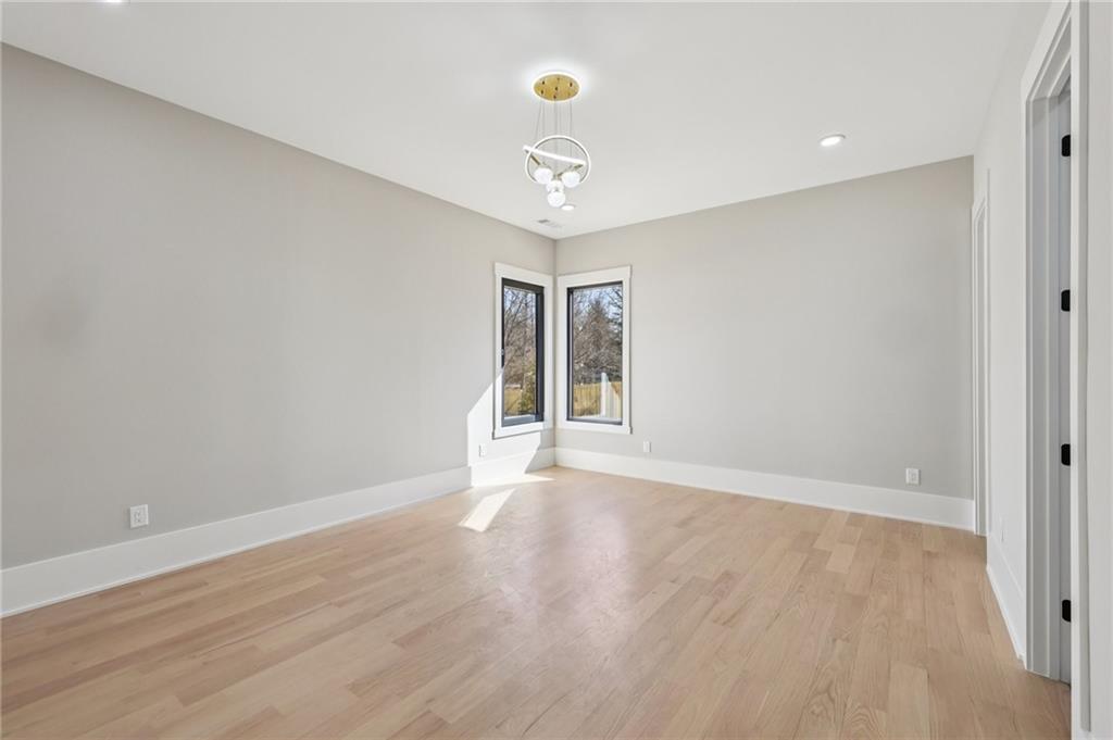 1556 Ewing Chapel Road Dacula, GA 30019 - Photo 25 of 67 a view of an empty room with window and wooden floor