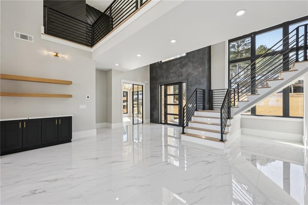 1556 Ewing Chapel Road Dacula, GA 30019 - Photo 6 of 67 a view of entryway with stairs and a couch