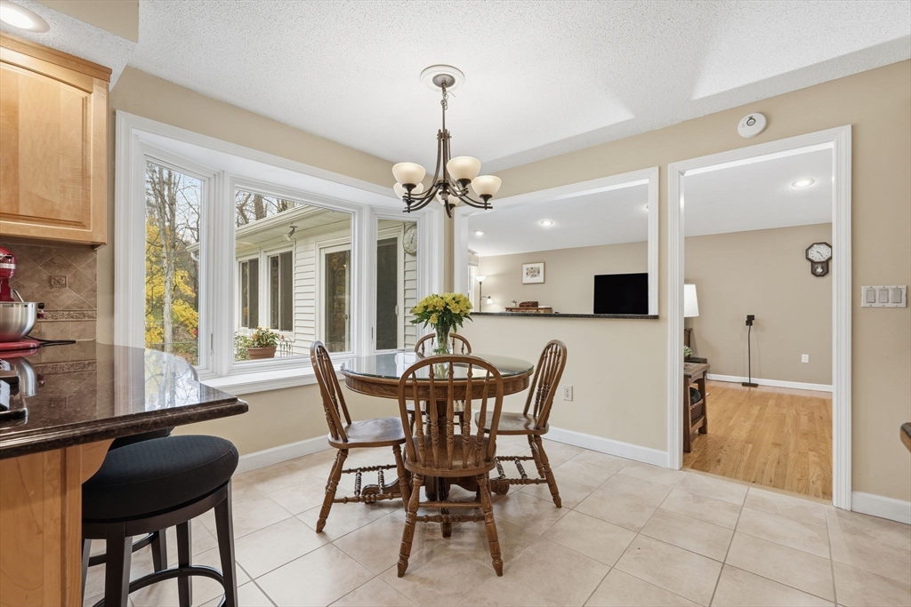 47 Academy Drive Longmeadow, MA 01106 - Photo 13 of 42 a view of a dining room with furniture and a chandelier