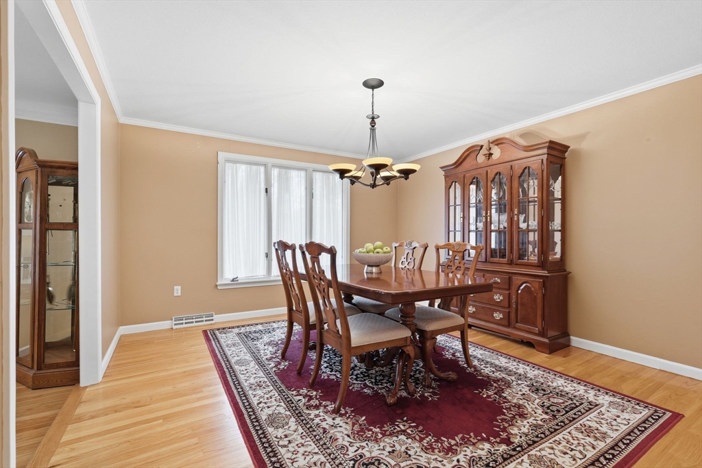 47 Academy Drive Longmeadow, MA 01106 - Photo 22 of 42 a dining room with furniture window and wooden floor