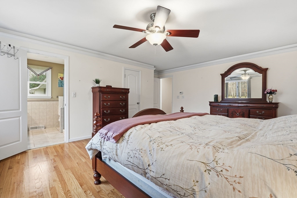 47 Academy Drive Longmeadow, MA 01106 - Photo 26 of 42 a bedroom with a bed and wooden floor