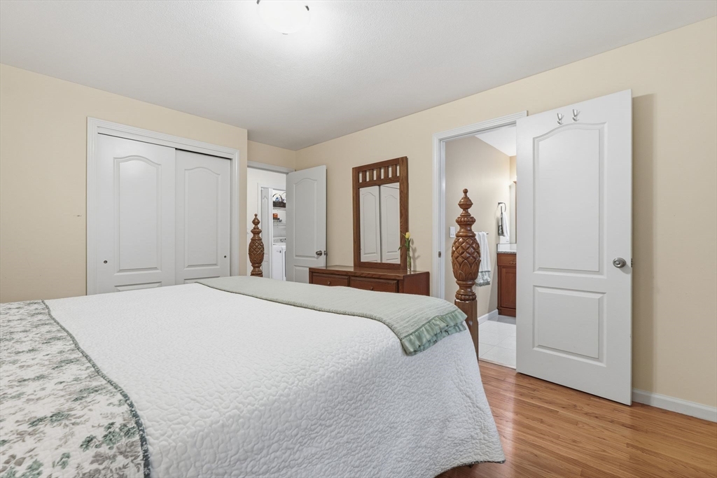 47 Academy Drive Longmeadow, MA 01106 - Photo 30 of 42 a bed room with a bed and a mirror