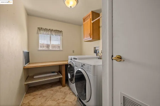 a view of livingroom with washer and dryer