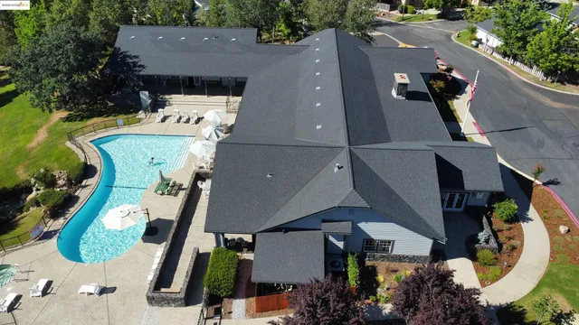 an aerial view of houses with yard
