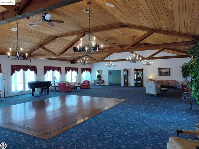 a room with lots of chairs and tables