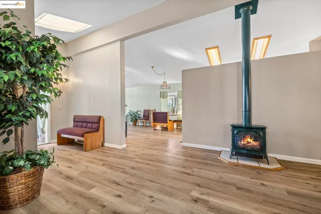 an empty room with furniture and wooden floor