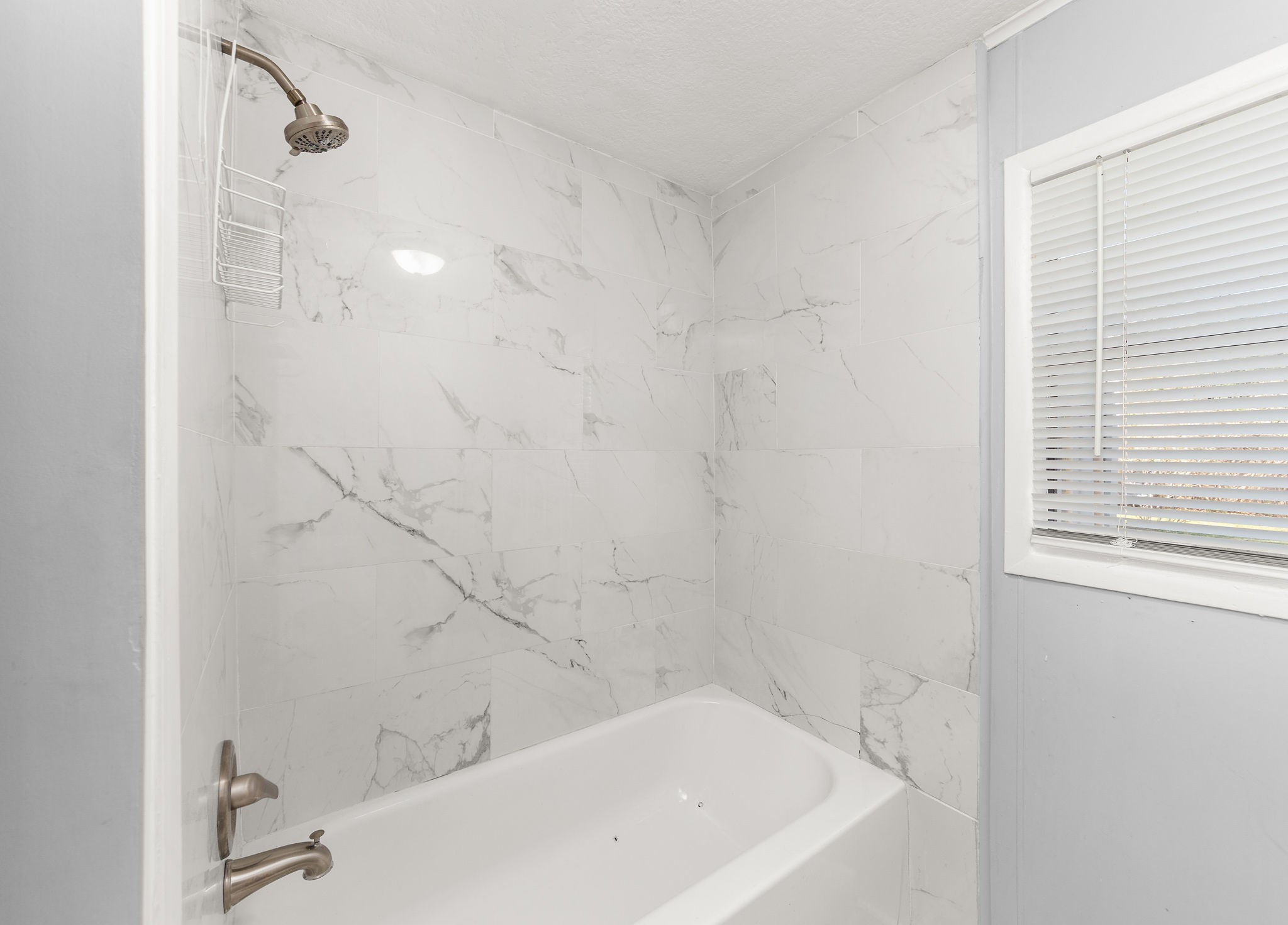 203 South Fig Street Sweeny, TX 77480 - Photo 16 of 20 a bathroom with a bathtub and shower