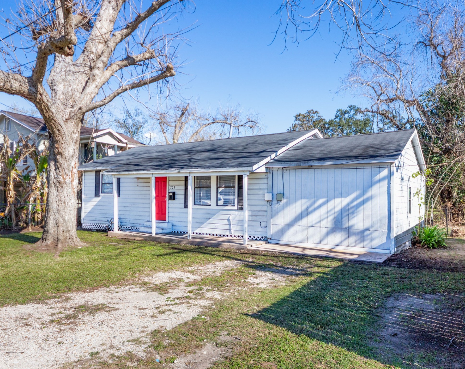 203 South Fig Street Sweeny, TX 77480 - Photo 2 of 20 a view of a house with backyard and a tree