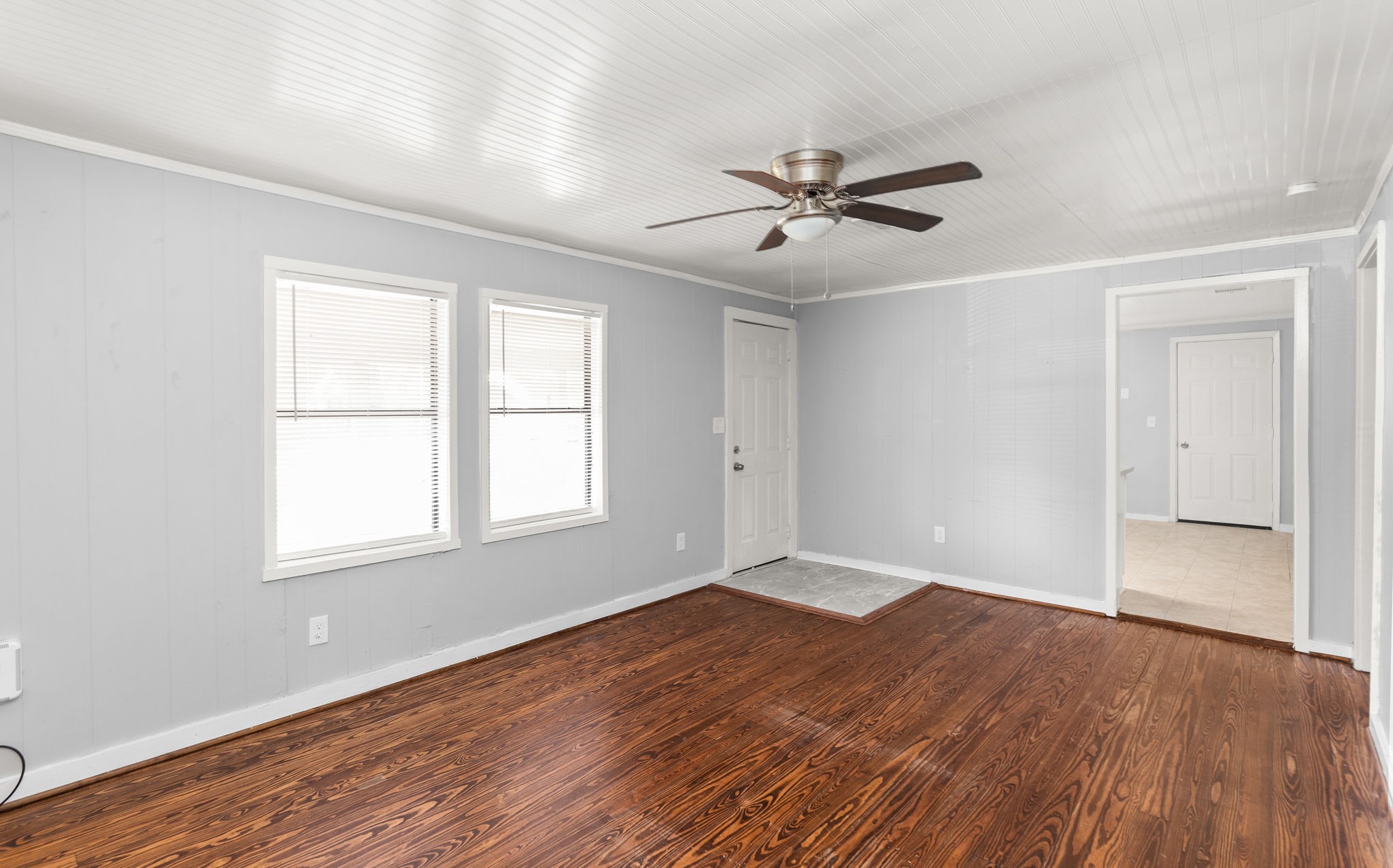 203 South Fig Street Sweeny, TX 77480 - Photo 4 of 20 a view of empty room with wooden floor and fan