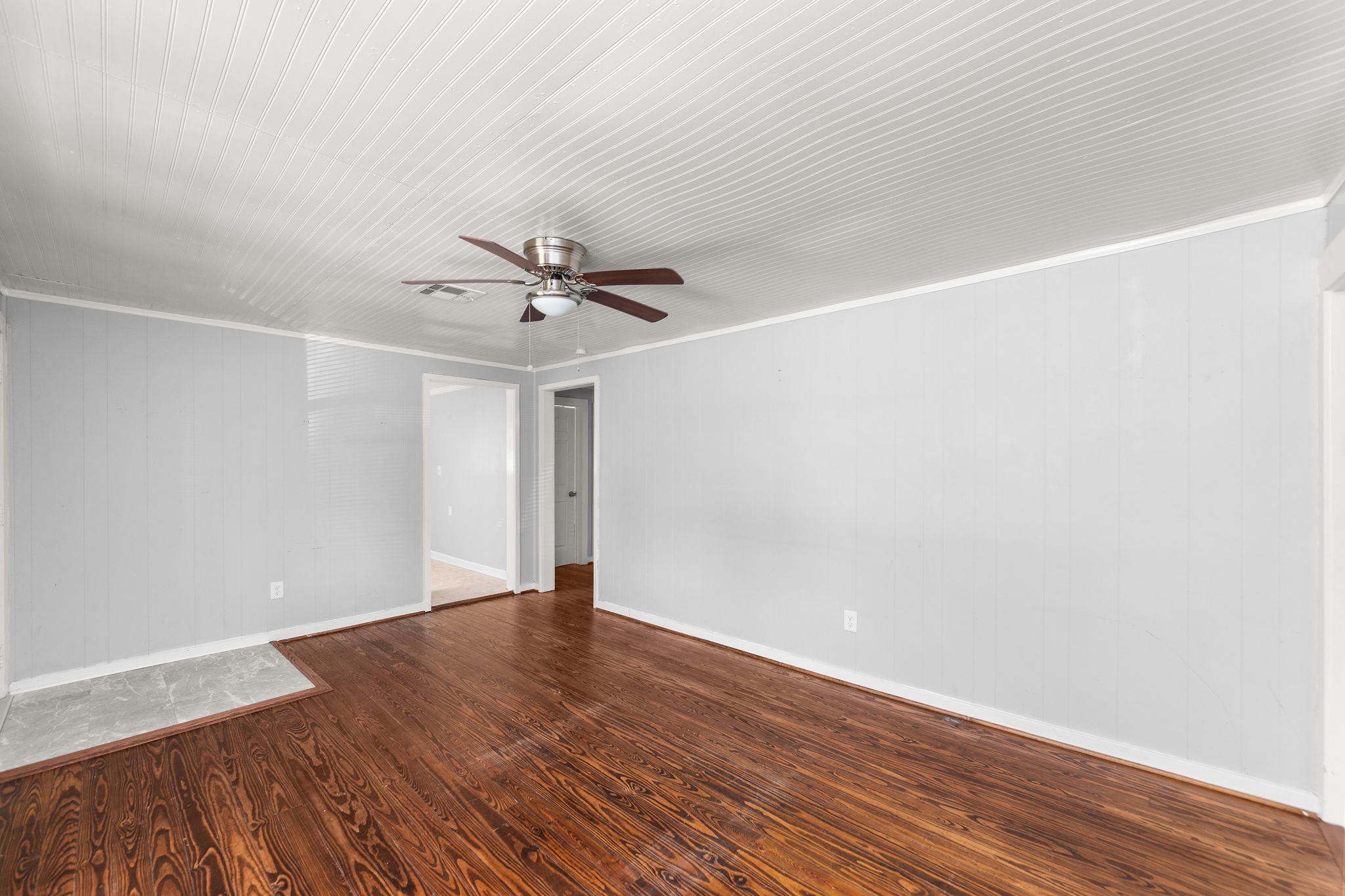 203 South Fig Street Sweeny, TX 77480 - Photo 5 of 20 a view of an empty room with wooden floor