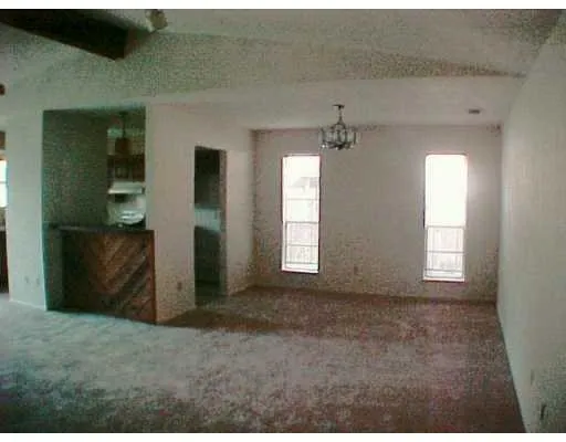 an empty room that has a window