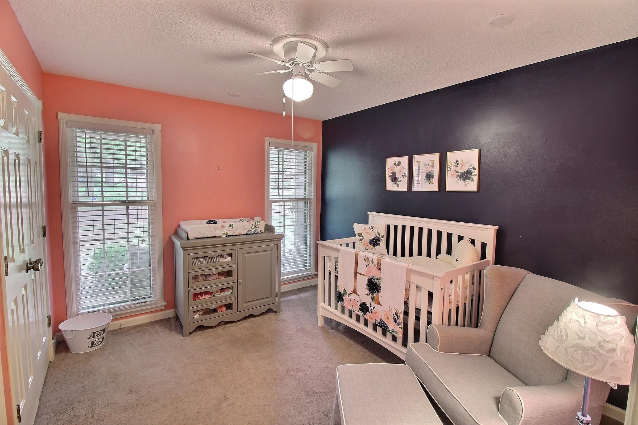 348 Rutledge Street Collierville, TN 38017 - Photo 15 of 19 a bedroom with furniture and a window