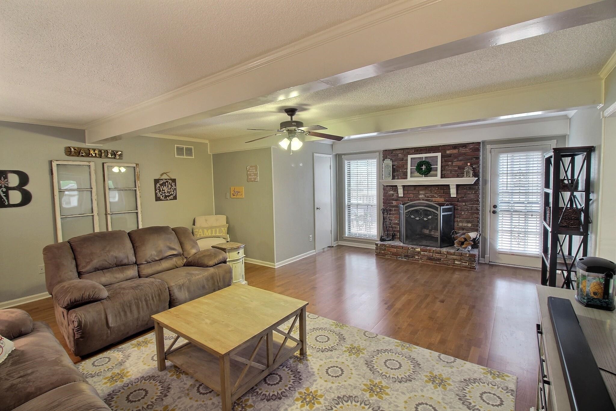 348 Rutledge Street Collierville, TN 38017 - Photo 4 of 19 a living room with furniture and a fireplace