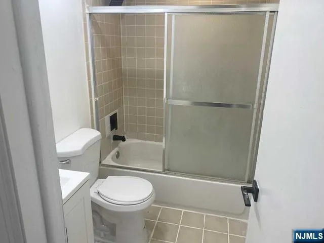 a bathroom with a toilet and shower